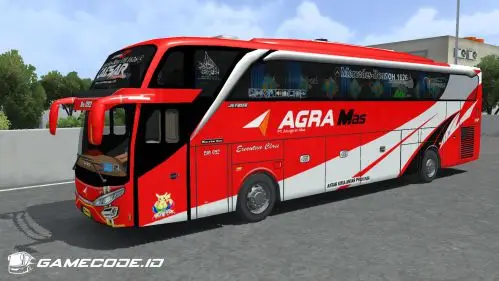 Bus merah-putih dengan tulisan Agra Mas dan aksen diagonal di bagian belakang